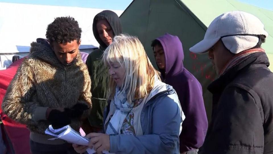 Professor Sue Clayton talks to asylum seekers in the Calais Jungle refugee camp. 